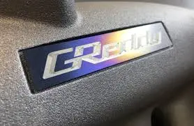Greddy Titanium Intake Manifold Badge (105Mm X 20Mm) - 18000201 1
